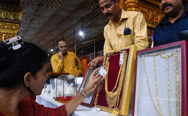 Gold, silver prices drop ahead of key US inflation data