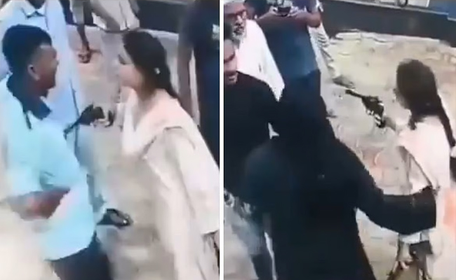 Young Woman Threatens Petrol Pump Worker with Revolver Young Woman Threatens Petrol Pump Worker with Revolver